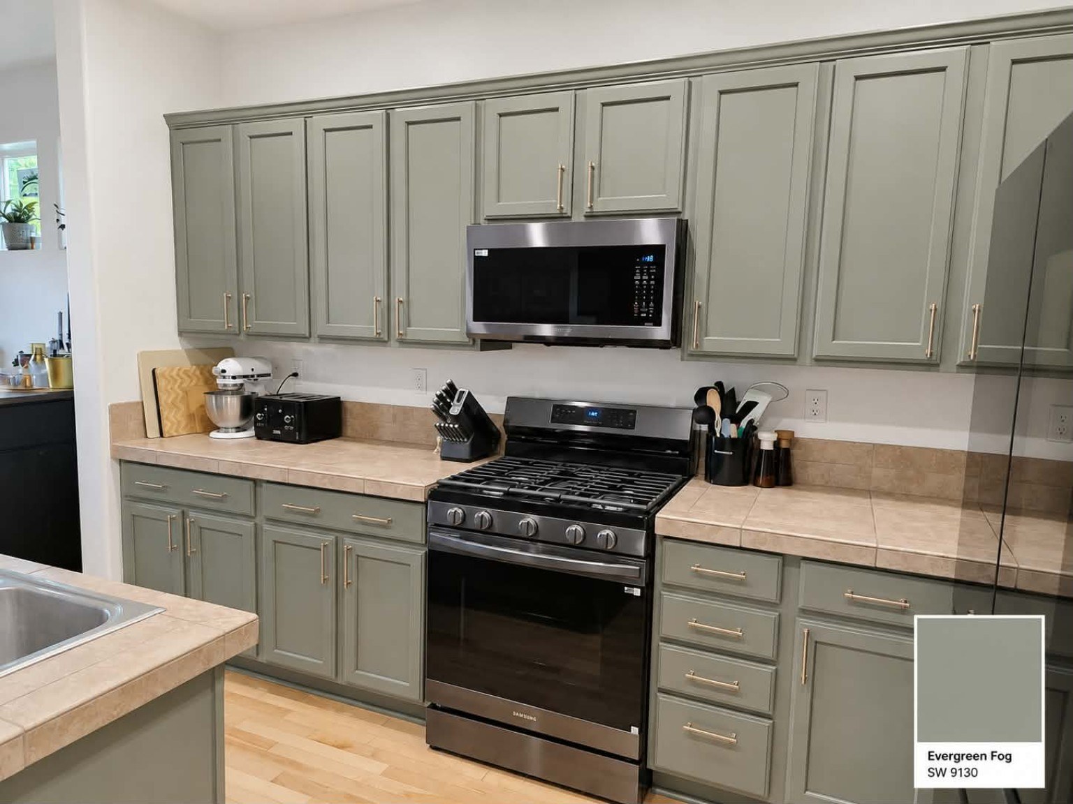 Professionally refinished kitchen cabinets by Riversons Painting