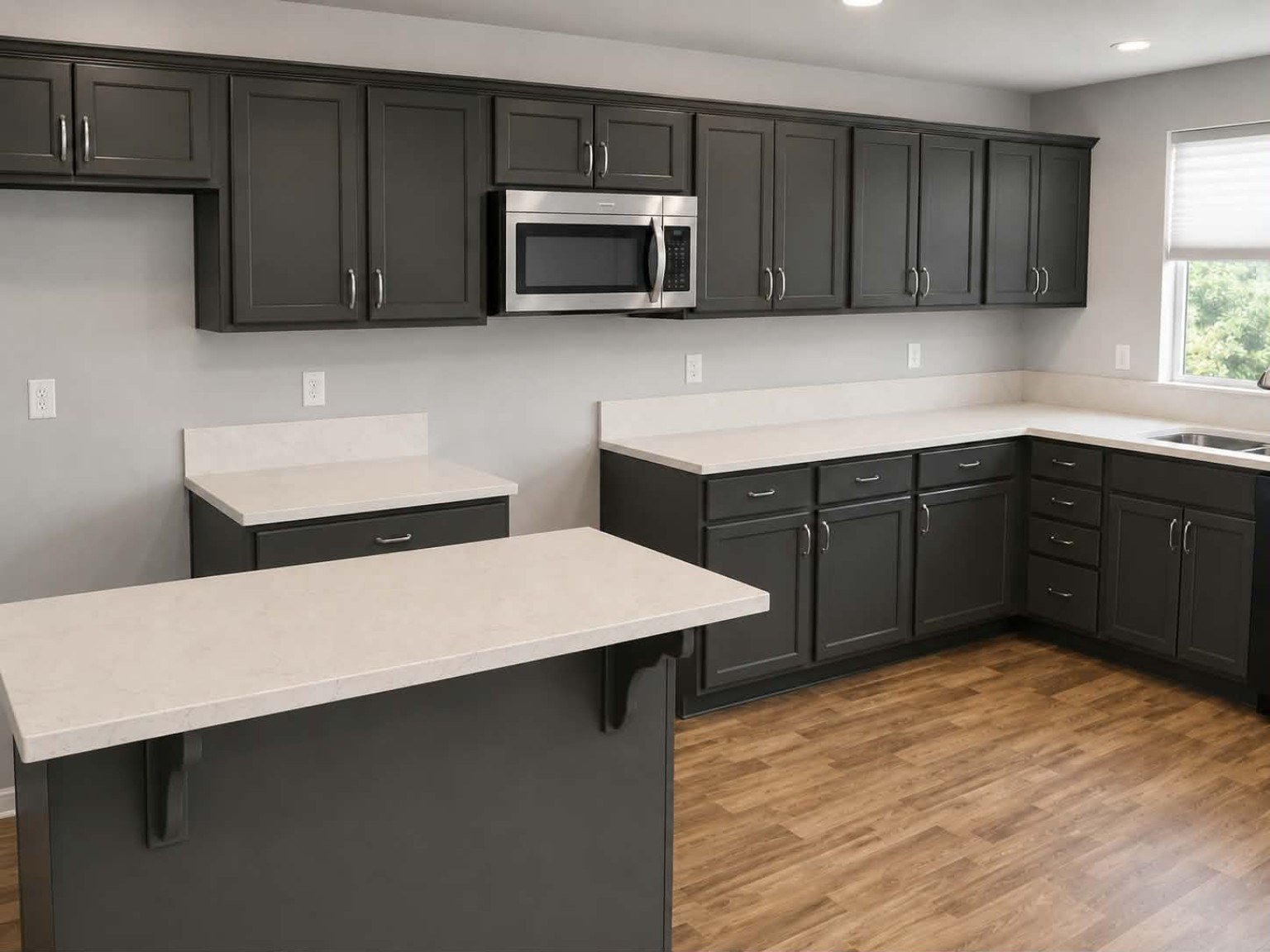 Professionally refinished kitchen cabinets by Riversons Painting