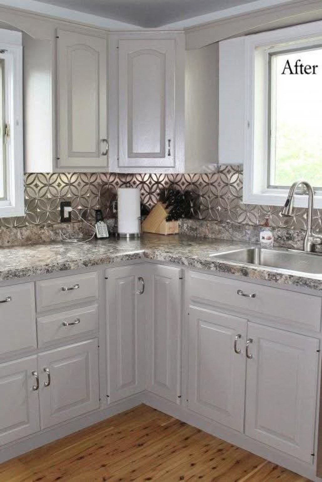 Professionally refinished kitchen cabinets by Riversons Painting